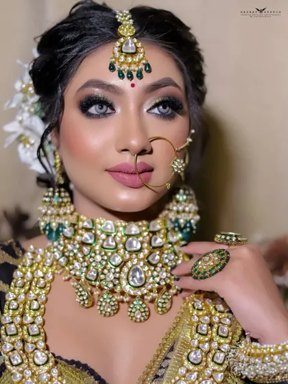 A captivating close-up that highlights the bride's striking eyes and flawless makeup. The composition is tight and focused, creating a powerful beauty shot.