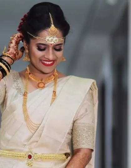 Another happy moment from Nikitha's wedding, showcasing her traditional bridal look.