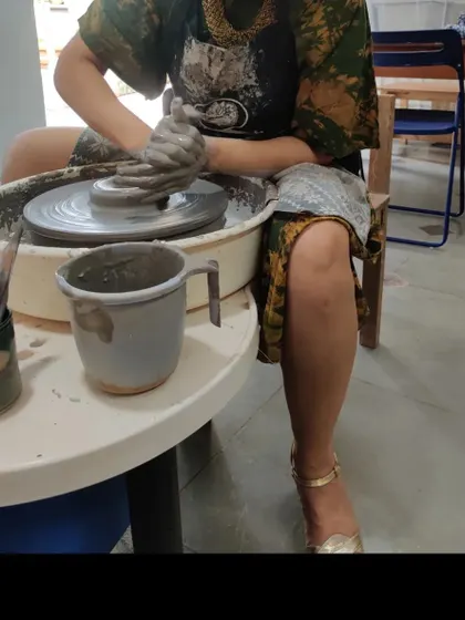 Who says you can't get your hands dirty and still be fabulous? A guest proves you can absolutely have time for a spin on the pottery wheel before heading out for a fun lunch with the girls.