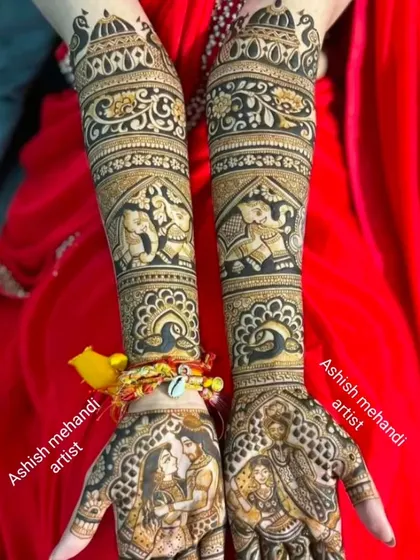 A stunning design featuring portraits of a couple on the palms, surrounded by traditional peacock and elephant motifs.