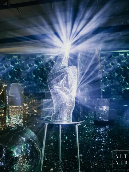 A mirrored sculpture captures the light at 'The Melting Disco Ball' after-party. This event was designed for the fiercely free-spirited, a dose of euphoric chaos where mirrors met disco in a seamless blend of past and present.