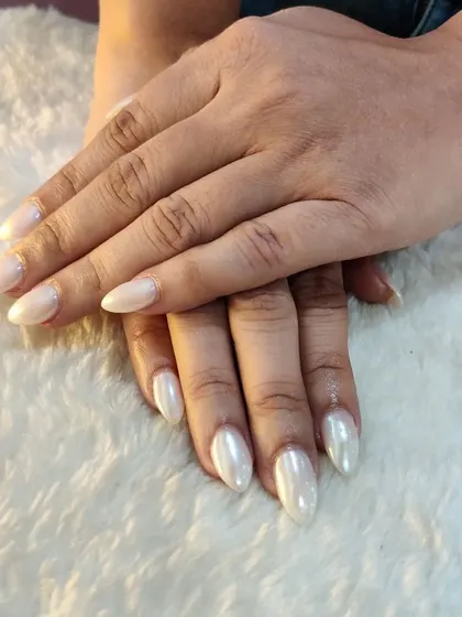 A full view of the 'Glazed Donut' nails, showcasing their clean, elegant, and glossy finish on beautifully shaped extensions.