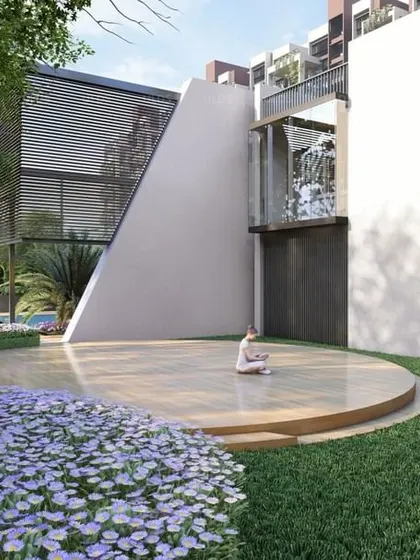 A serene yoga deck surrounded by lush flowers and greenery, providing a peaceful, dedicated space for wellness and meditation at the 'Villa on Sky' project.