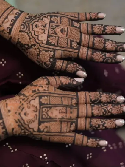 A close-up of a beautiful back-hand design. The intricate patterns and floral motifs are perfect for any festive occasion.