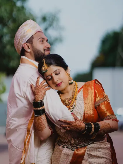 A tender and intimate portrait of the couple, their relaxed and happy expressions telling a story of love and comfort.