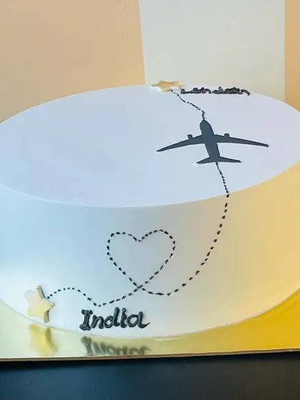 The travel-themed farewell cake, perfect for wishing someone a safe and happy journey on their next adventure.