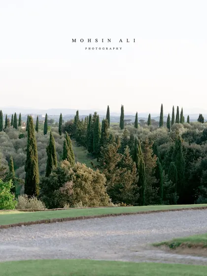 The classic, picturesque landscape of Tuscany, with its iconic cypress trees. This is the kind of view that makes an Italian destination wedding so special.