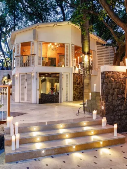 The entrance to our restaurant at night, with steps lit by candles, welcoming you into a world of Spanish warmth and hospitality.
