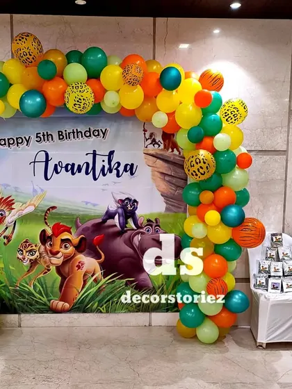 A full view of the Lion Guard party setup, including a small display for photos on the side. This shows how I can incorporate personal touches into the themed decor.