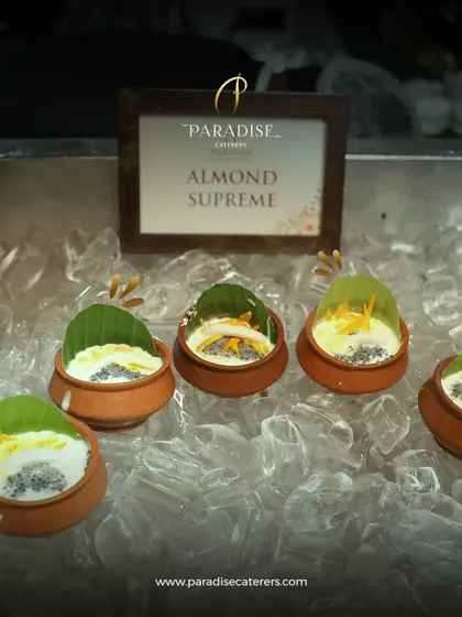 Indulge in the richness of our Almond Supreme. This traditional Indian dessert is served chilled in earthen pots, topped with nuts and a banana leaf for an authentic touch.
