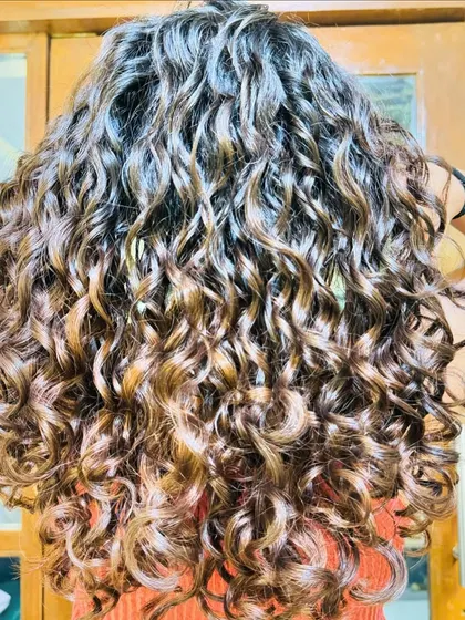A collection of my other no-bleach balayage and color work, showcasing a variety of tones from subtle browns to vibrant reds on different curl types.