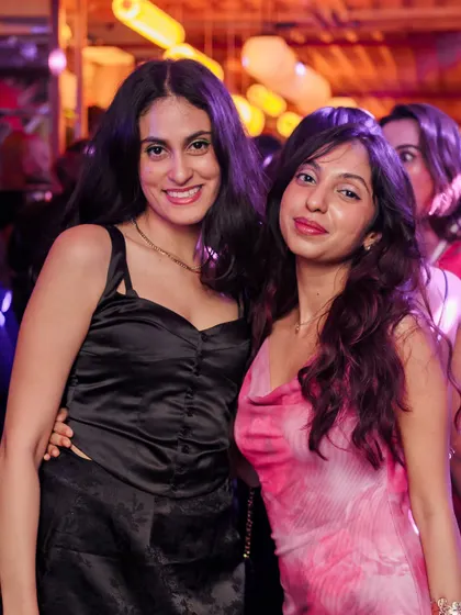 Friends posing for a picture, capturing a memory from another legendary night at Monkey Bar.