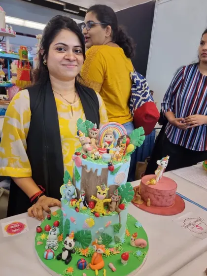 This was taken on the first day of the competition. I was exhausted after two sleepless nights, but seeing my finished jungle cake on display made it all worthwhile.