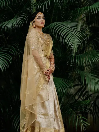 A duplicate image of 68, showing the full view of the stunning all-gold Langa Dhavani style saree.