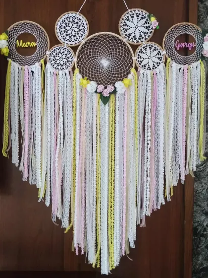"Double the Dreams, Twice the Love." We created this pink and yellow floral cluster dreamcatcher to celebrate twin sisters, Meera and Gargi, reflecting their beautiful, shared bond.