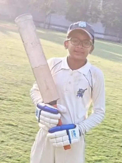 A young batsman with his bat, ready for action during the Christmas Cup U-12.