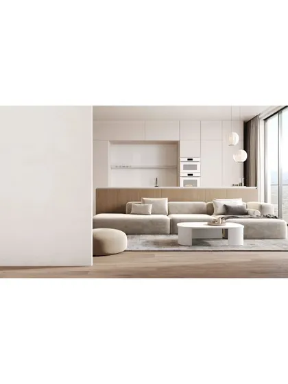 A minimalist living and kitchen area. The clean lines, neutral color palette, and integrated appliances create a seamless and serene open-plan space.
