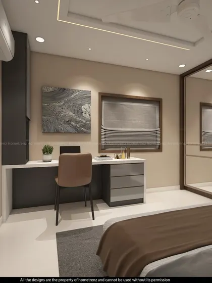 This guest bedroom combines a workspace with a cozy sleeping area. The mirrored wardrobe and light color scheme make the room feel spacious.