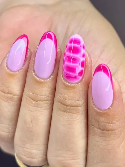 A close-up of the textured pink accent nail. This technique adds an unexpected and modern twist to a classic pink manicure, a skill that will impress your clients.