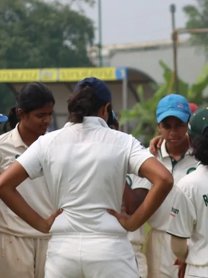 A team huddle where the captain gives instructions to her players.