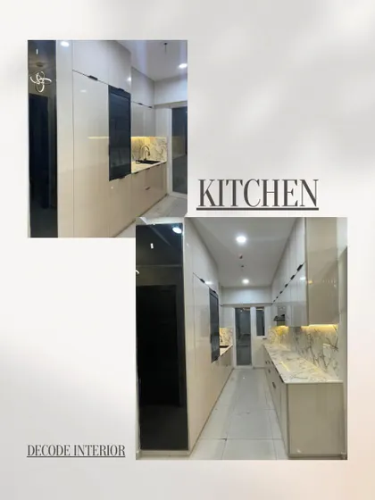 A complete look at a modern galley kitchen we designed. This space features handleless off-white cabinets, a striking marble-look countertop and backsplash, and a tall, tinted mirror cabinet for added depth.