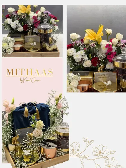 This gifting arrangement combines my gourmet treats with fresh flowers on a rustic wooden tray. It features elegant glass jars and a velvet pouch, creating a luxurious and heartfelt presentation.
