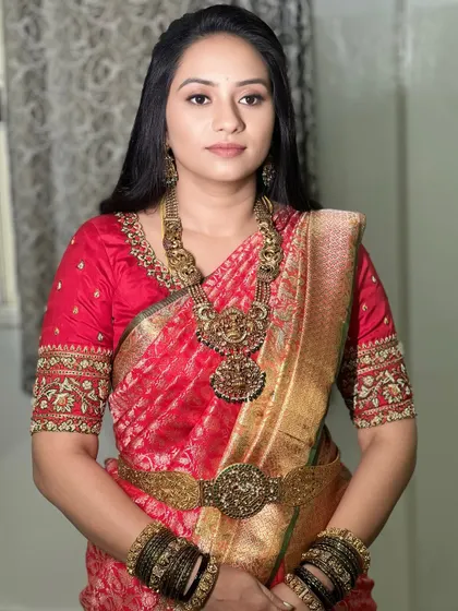A direct portrait of the bride, her natural beauty shining through. The makeup is minimal, focusing on flawless skin and a soft lip, proving that less can be more.