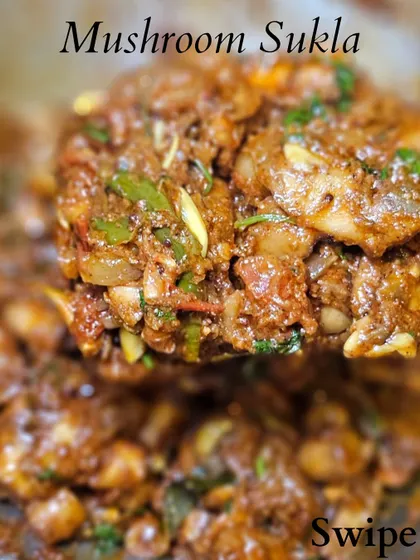 A spoonful of delicious Mushroom Sukka, showcasing the texture and rich masala of this popular dish.