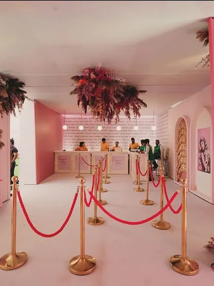 The registration and welcome corridor for the BWF meetup. I used arches, hanging florals, and soft pink lighting to create an immersive and stylish entry experience.