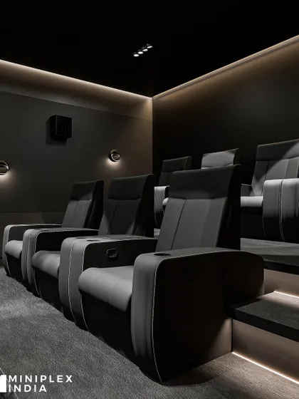 A closer look at the premium recliners in the 'Shadow Luxe' design. Notice the ergonomic support, built-in cup holders, and sleek finish that combines comfort with a modern aesthetic. The subtle wall sconces provide just enough ambient light without distracting from the screen.