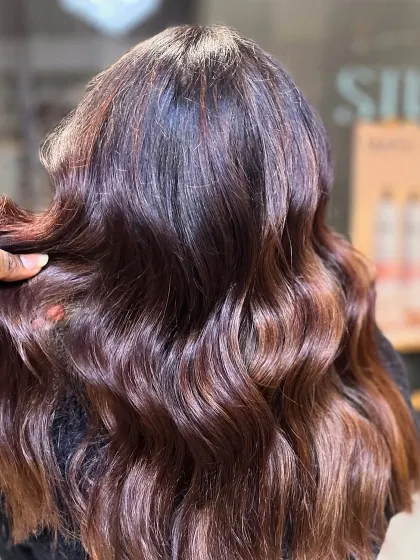 Love is in the hair. This image captures the beauty of freshly styled hair with a healthy sheen.