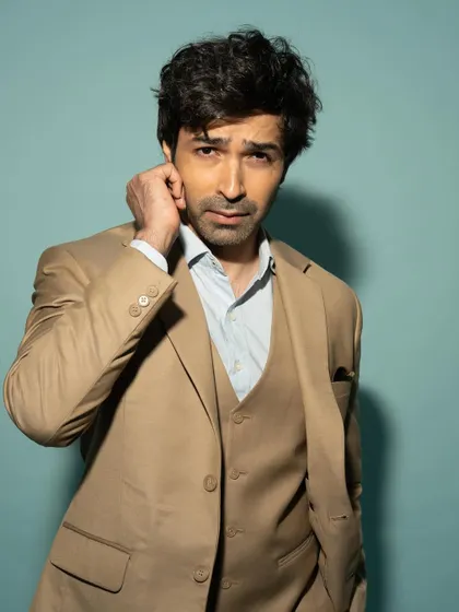 A close-up with a slightly more intense and thoughtful expression, demonstrating his versatility as an actor.