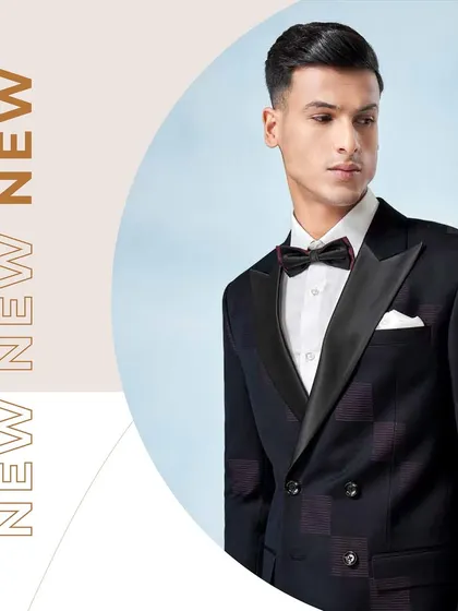 Our new collection features suits designed to turn heads. This double-breasted tuxedo with a subtle check pattern and a black satin lapel leaves a lasting impression.