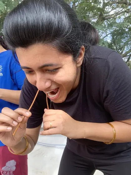 A student practices Sutra Neti, a traditional yogic cleansing technique (kriya) for the nasal passages.