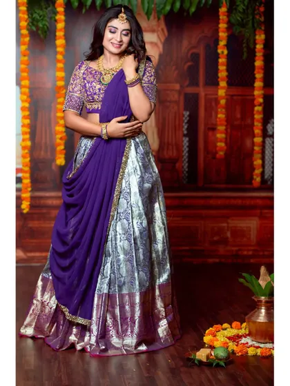 A full-length shot showing the beautiful flow and drape of the half-saree.