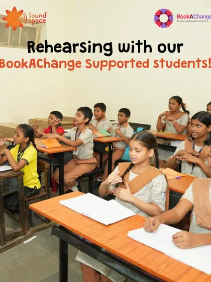 Rehearsing with our BookAChange supported students in their classroom, using hand gestures to learn a song.