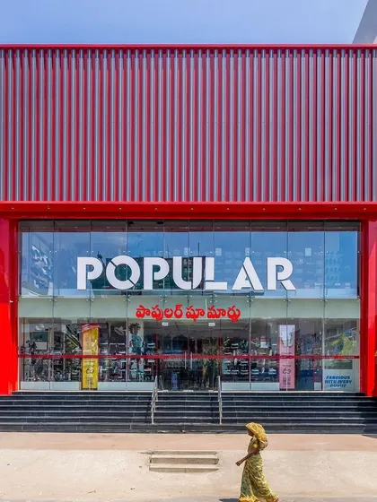 The final, stunning facade of the Popular Shoe Mart in Tirupati.