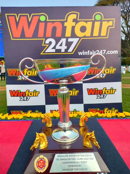 The Bangalore Race Course 161st Year Commemoration Trophy, a classic silver cup with golden horse head handles.