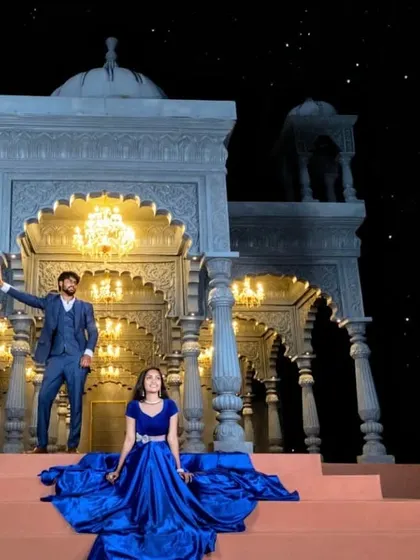 A magical night shoot. The electric blue gown shines under the moonlight, creating a dreamy and romantic scene for this couple.