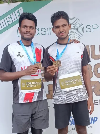 Two of my athletes proudly showing their finisher medals at the Hennur Bamboo Ultra Marathon. It takes immense discipline to complete a 30k race.