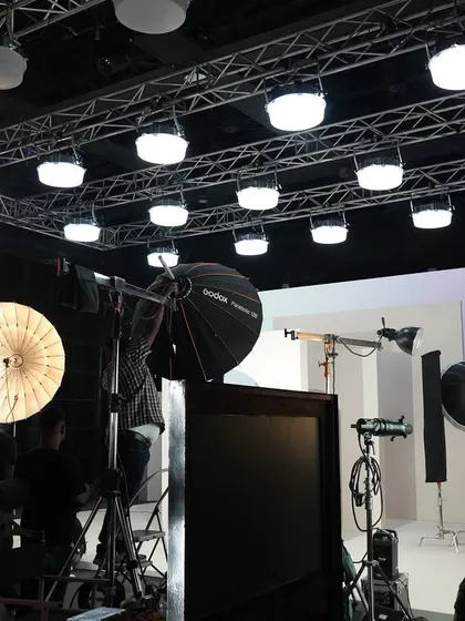 Behind the scenes of a shoot for Limelight, showing our lighting setup. We used a large overhead truss rigged with Creamsource SpaceX fixtures to create a soft, even top light.