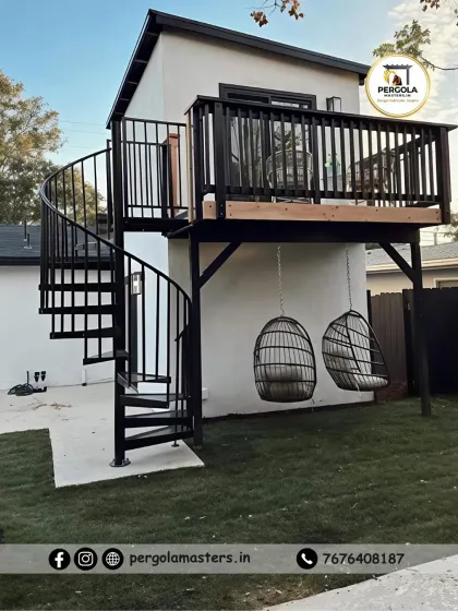 This project features a functional spiral staircase providing access to a raised deck. The space-saving design is ideal for compact backyards, connecting different levels while adding a modern architectural element.