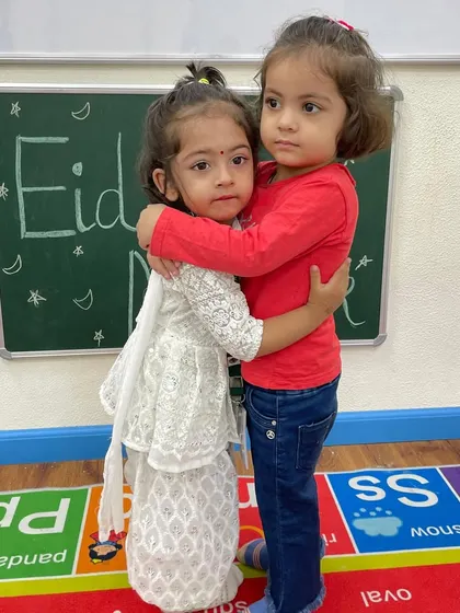 A sweet moment of friendship captured during our Eid celebration. We foster an environment of kindness and camaraderie among our little stars.