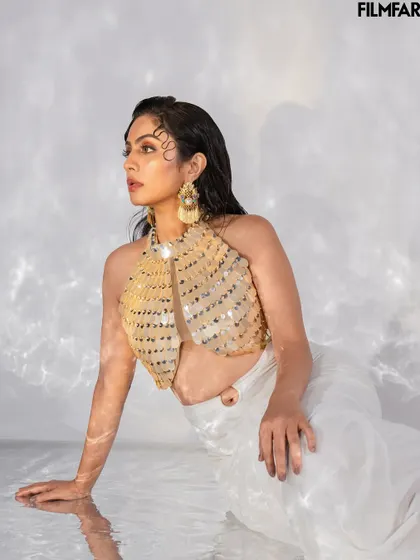 Another angle from the water-based set for Filmfare. This image captures a candid, off-gaze moment, adding a layer of depth to the editorial story.