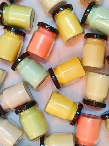 A colorful array of my mini jar candles. You can customize your favorite scents and colors with me.
