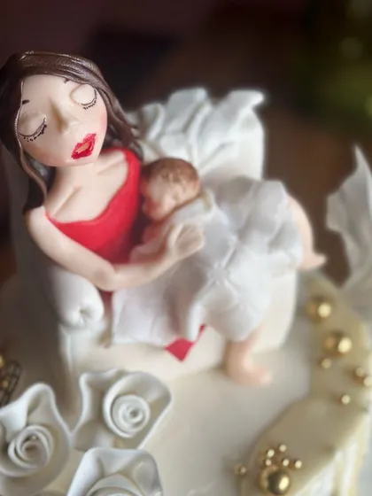Celebrating the sweetest chapter yet. Our custom new mommy cake is baked with love, featuring a tender moment between a mother and her newborn, to make her birthday extra special.