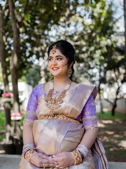 An outdoor shot capturing the soft, natural light on this mom-to-be. The makeup looks fresh and timeless, perfect for an event that is both indoors and outdoors.