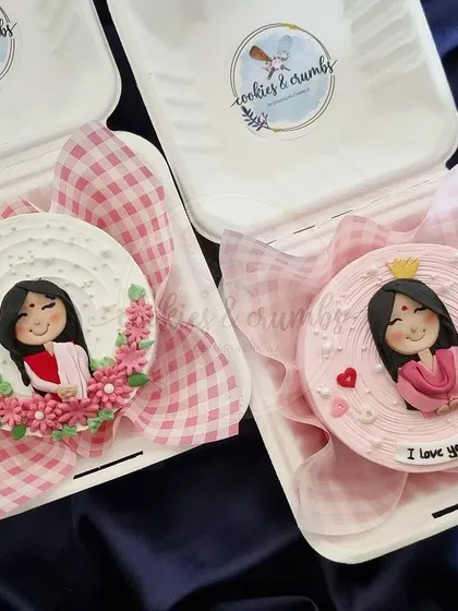 Two custom bento cakes for two special moms. Both feature hand-drawn edible portraits and are packed in my signature eco-friendly lunchboxes with cute gingham paper.