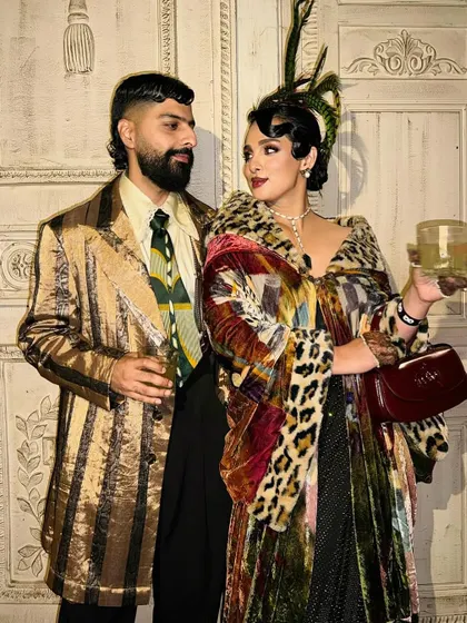 A styled shot of the couple. The vintage hairstyle holds its shape perfectly, contributing to the overall retro aesthetic of the photoshoot.