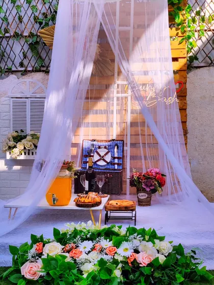 Here is another look at my classic surprise picnic arrangement. The combination of a sheer canopy, a fully stocked picnic basket, and fresh flowers makes any rooftop or backyard feel special.